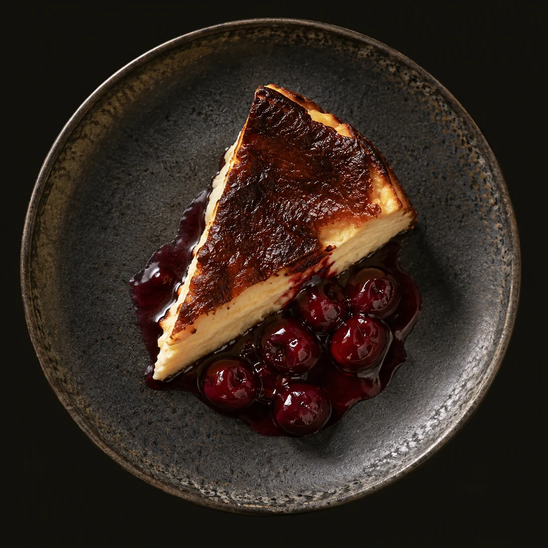 Burnt Basque cheesecake — Sour cherries · vanilla cream